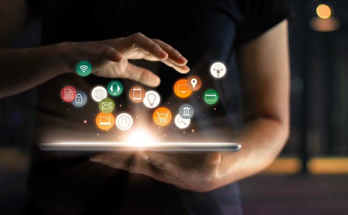 Digital online marketing commerce sale concept. Woman using tablet payments online shopping and icon customer network connection on hologram virtual screen, m-banking and omni channel.